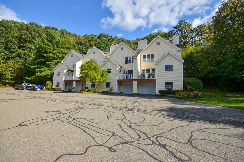 19 Millers Way, Unit C Sutton, MA 01590 - Photo 1 of 37 a view of a white house with a yard and potted plants