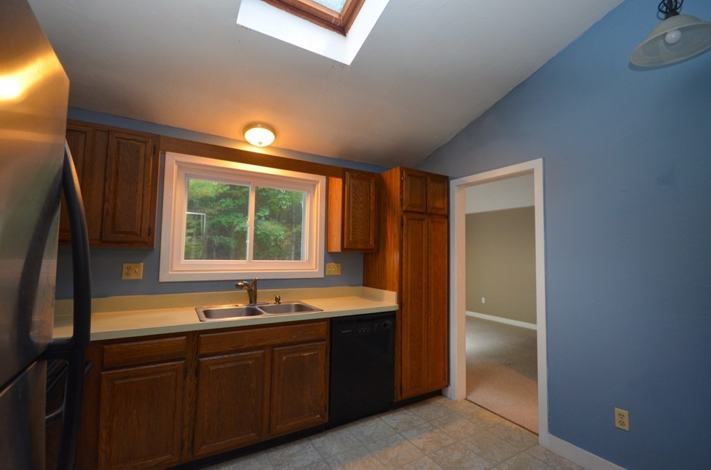19 Millers Way, Unit C Sutton, MA 01590 - Photo 11 of 37 a kitchen with a sink and large window