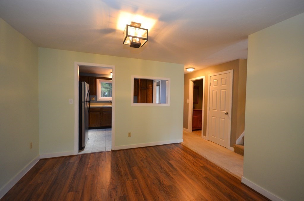 19 Millers Way, Unit C Sutton, MA 01590 - Photo 12 of 37 a view of empty room with wooden floor
