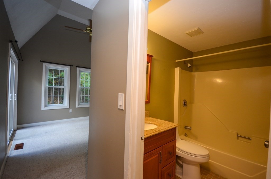 19 Millers Way, Unit C Sutton, MA 01590 - Photo 14 of 37 a bathroom with a granite countertop sink toilet and shower