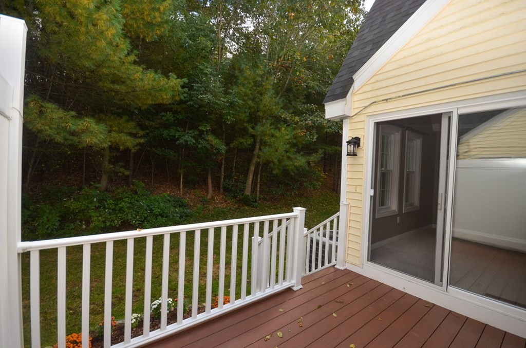 19 Millers Way, Unit C Sutton, MA 01590 - Photo 18 of 37 a balcony with trees in front of it