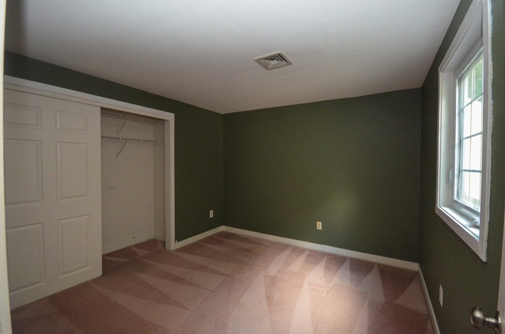 19 Millers Way, Unit C Sutton, MA 01590 - Photo 23 of 37 an empty room with windows