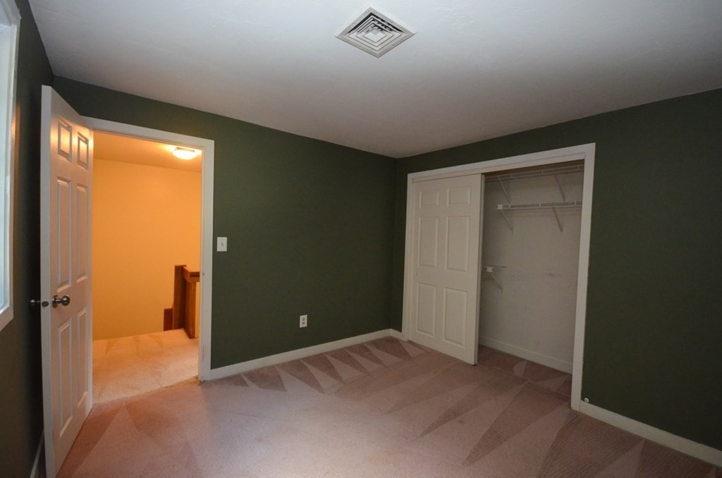 19 Millers Way, Unit C Sutton, MA 01590 - Photo 24 of 37 a view of a livingroom with a ceiling fan and window