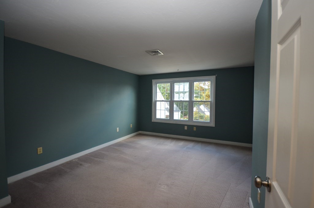 19 Millers Way, Unit C Sutton, MA 01590 - Photo 25 of 37 a view of an empty room with a window