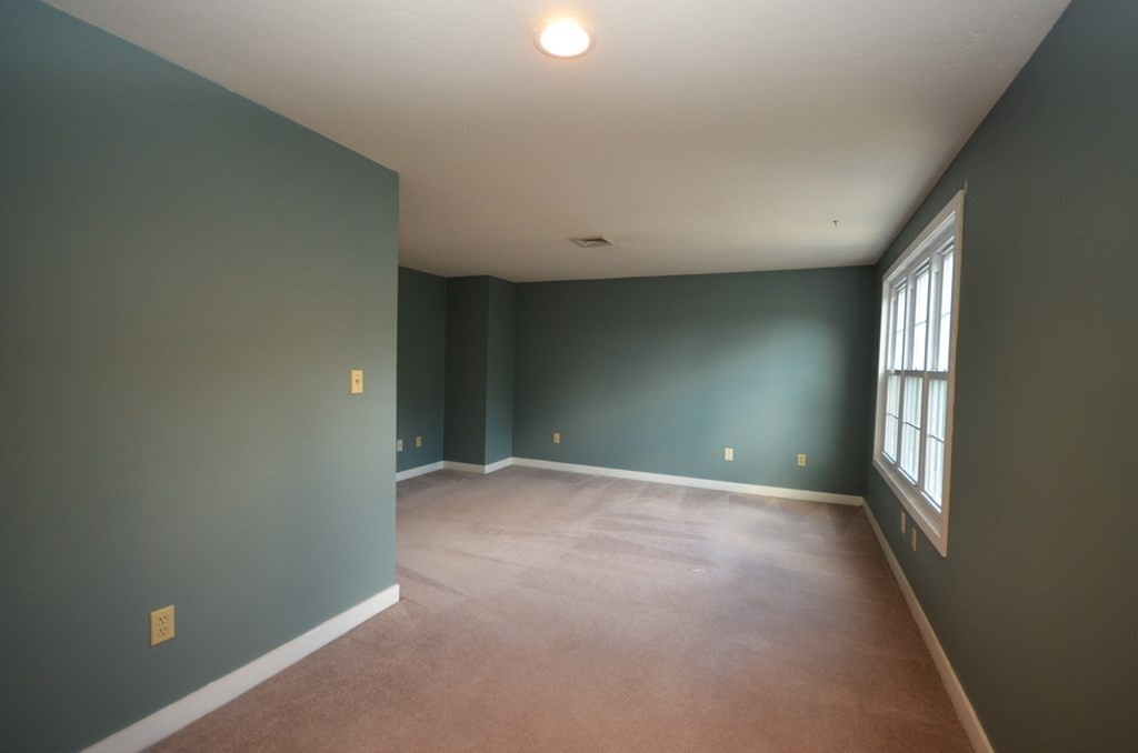 19 Millers Way, Unit C Sutton, MA 01590 - Photo 27 of 37 an empty room with windows and entrance