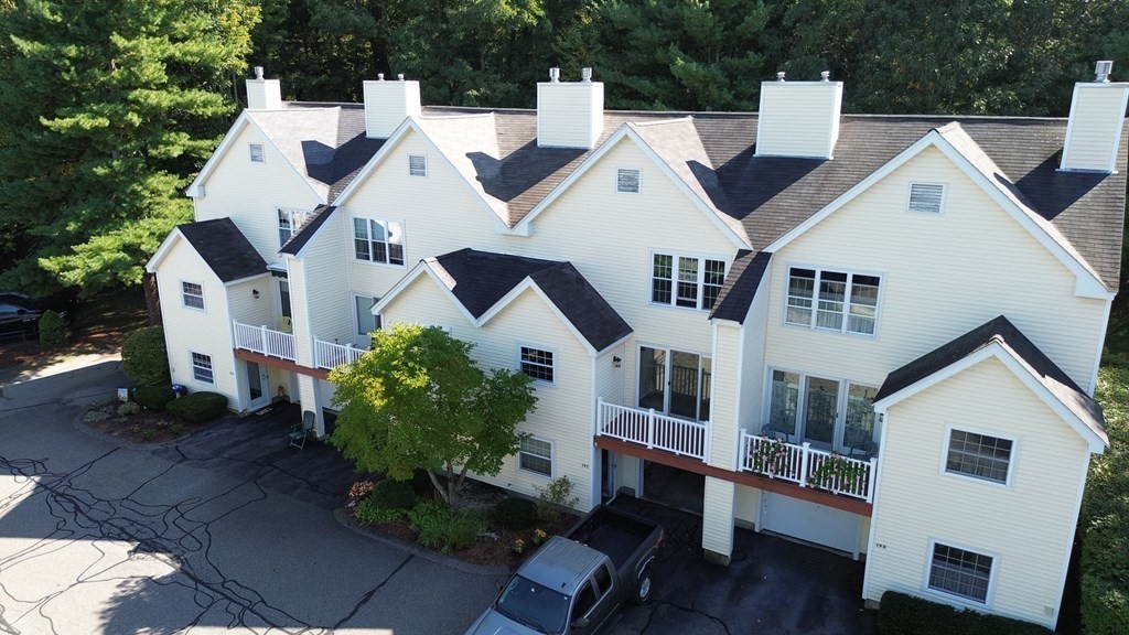 19 Millers Way, Unit C Sutton, MA 01590 - Photo 36 of 37 a view of multiple houses with a yard