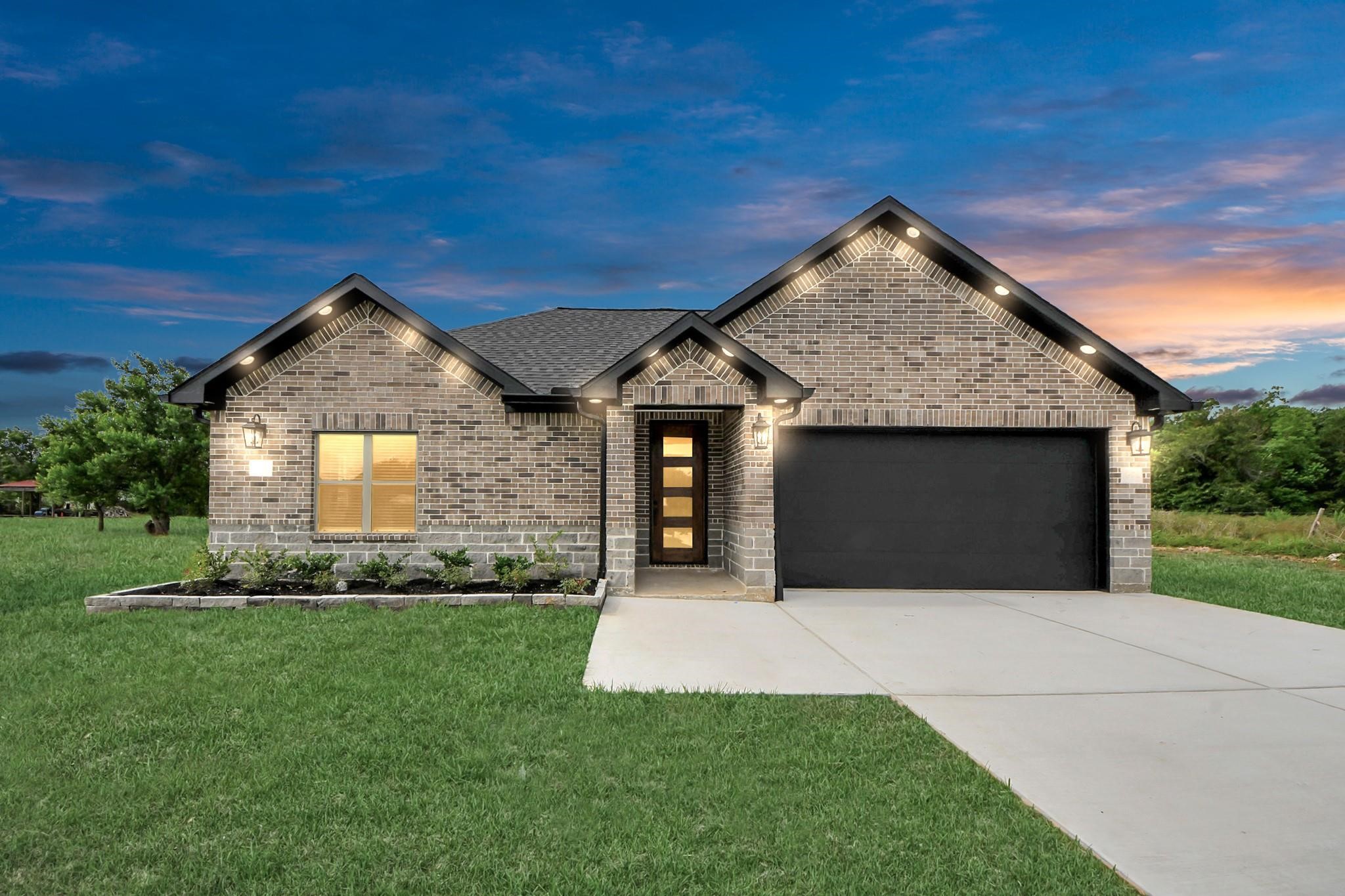 Beautifully designed single story home featuring a modern exterior, clean lines, and great curb appeal.