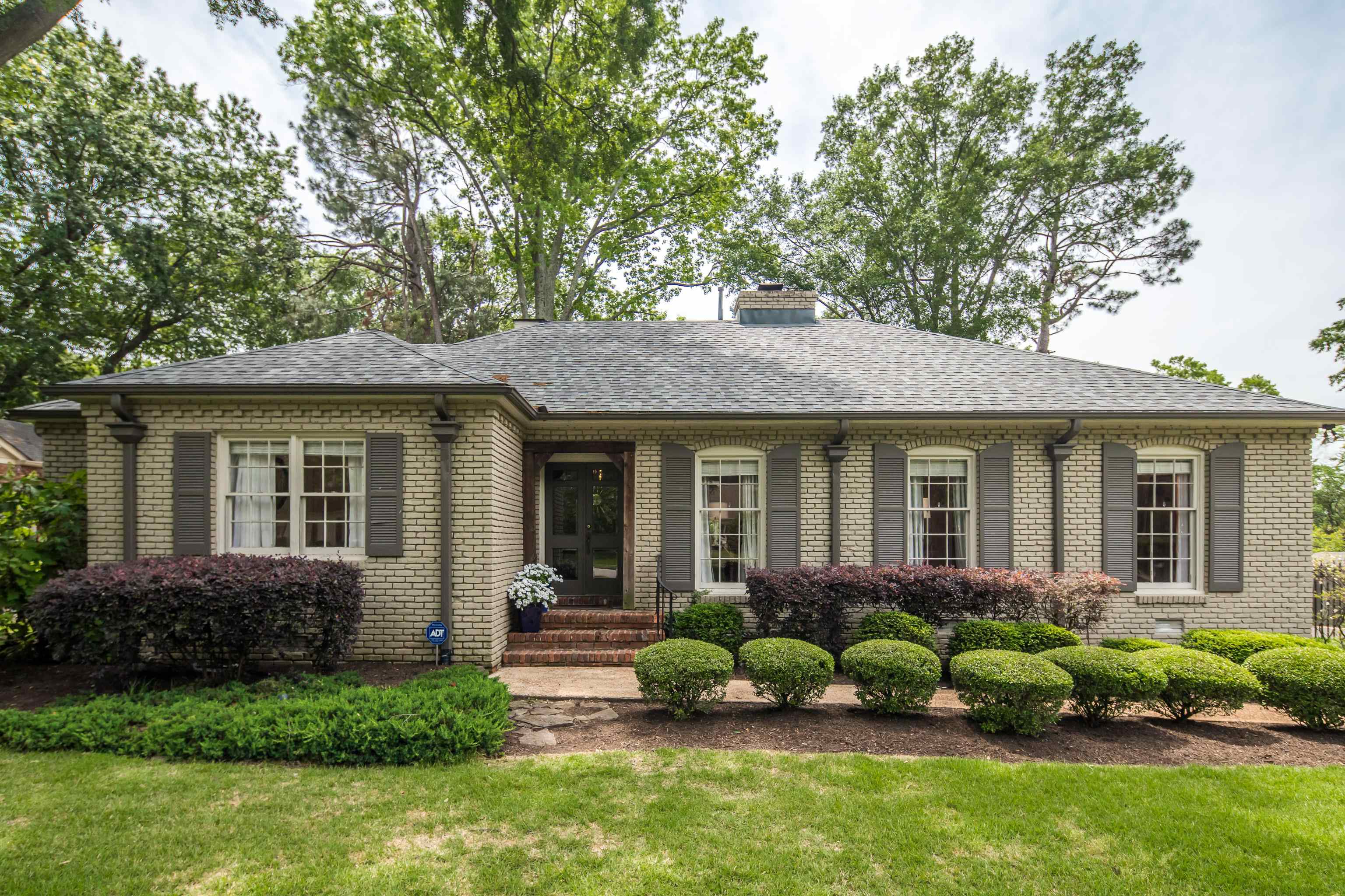 5371 South Angela Road Memphis, TN 38120 - Photo 1 of 25 a view of a house with a yard and plants