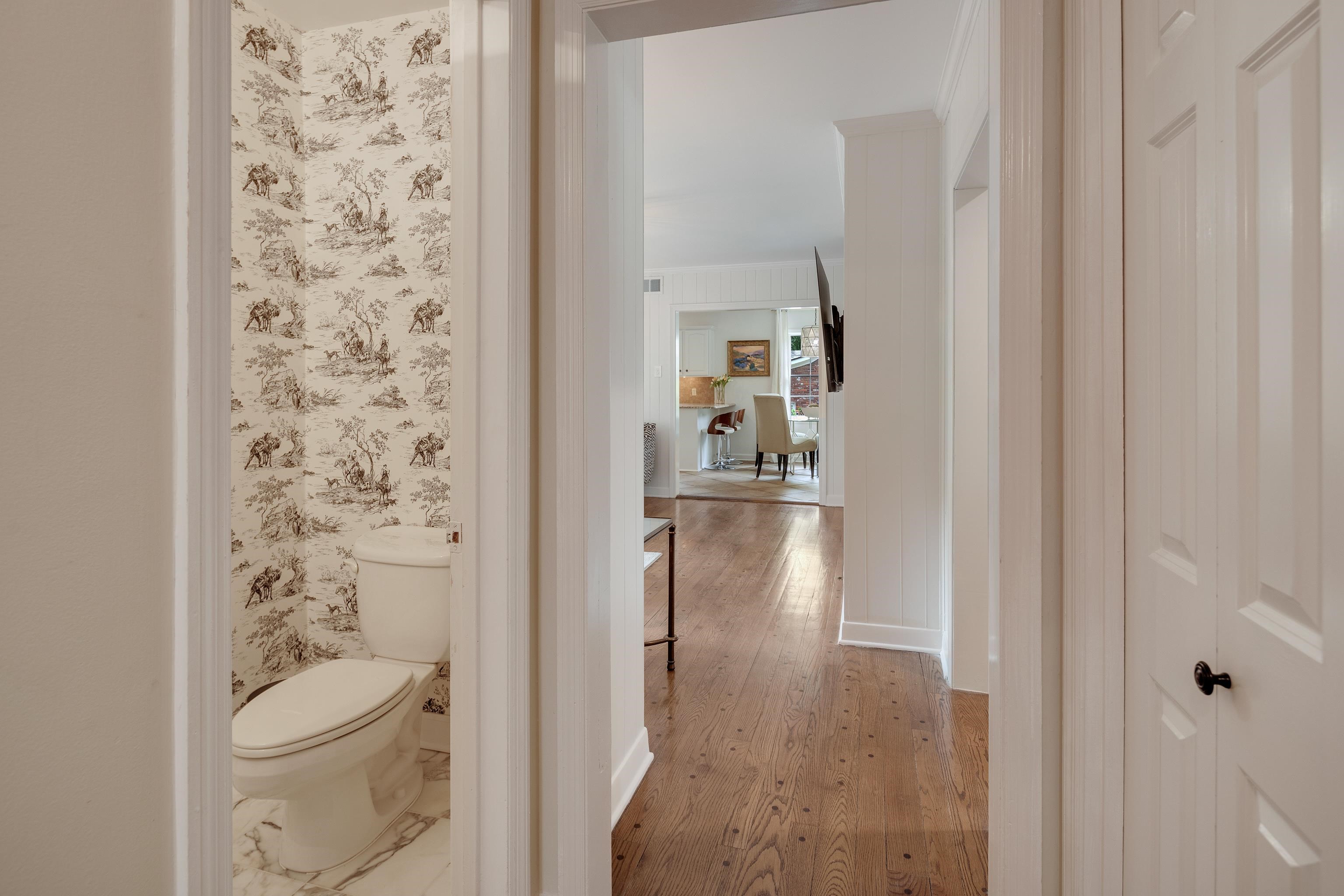 5371 South Angela Road Memphis, TN 38120 - Photo 13 of 25 a bathroom with a toilet and a shower curtain