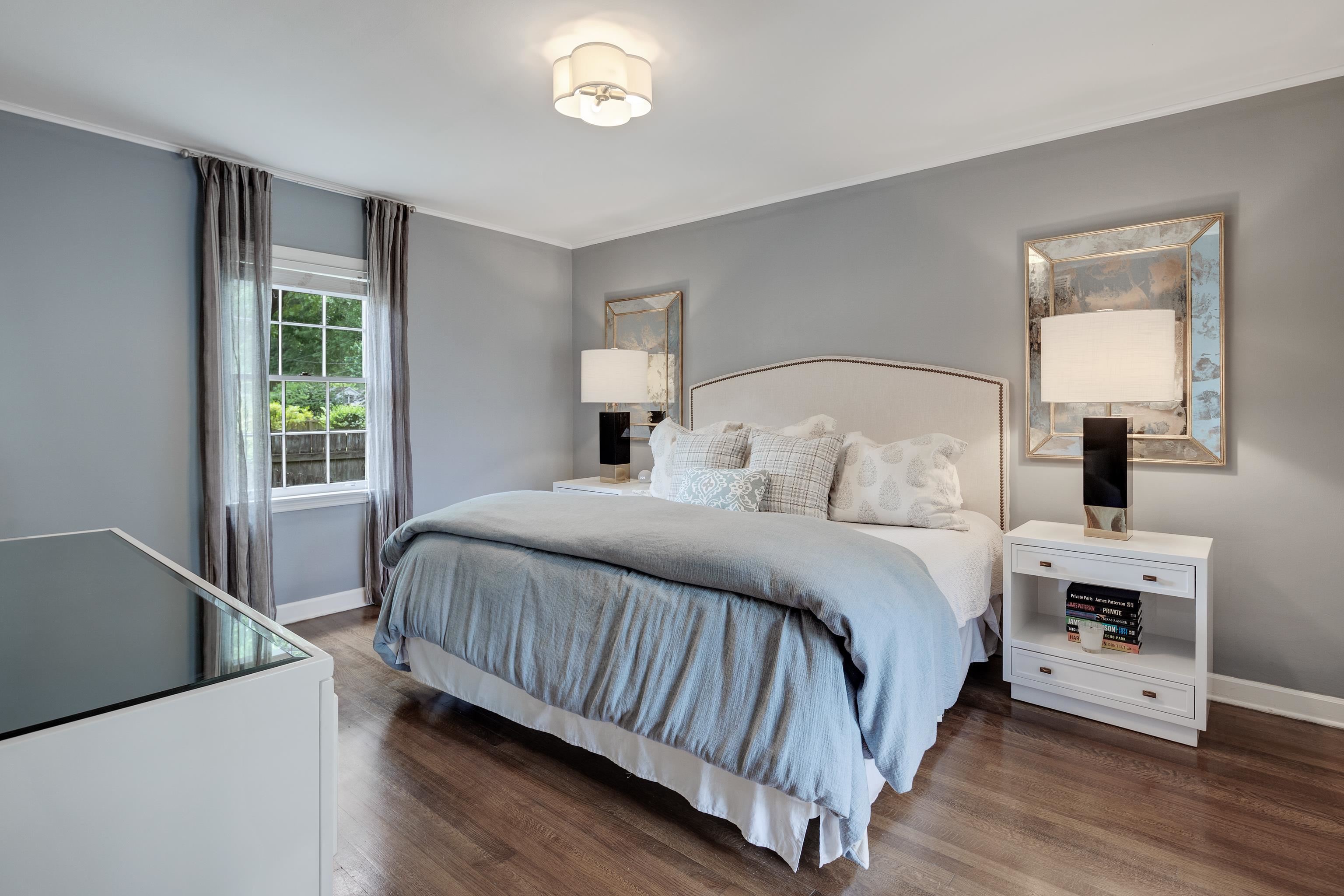 5371 South Angela Road Memphis, TN 38120 - Photo 14 of 25 a bedroom with a bed and a night stand