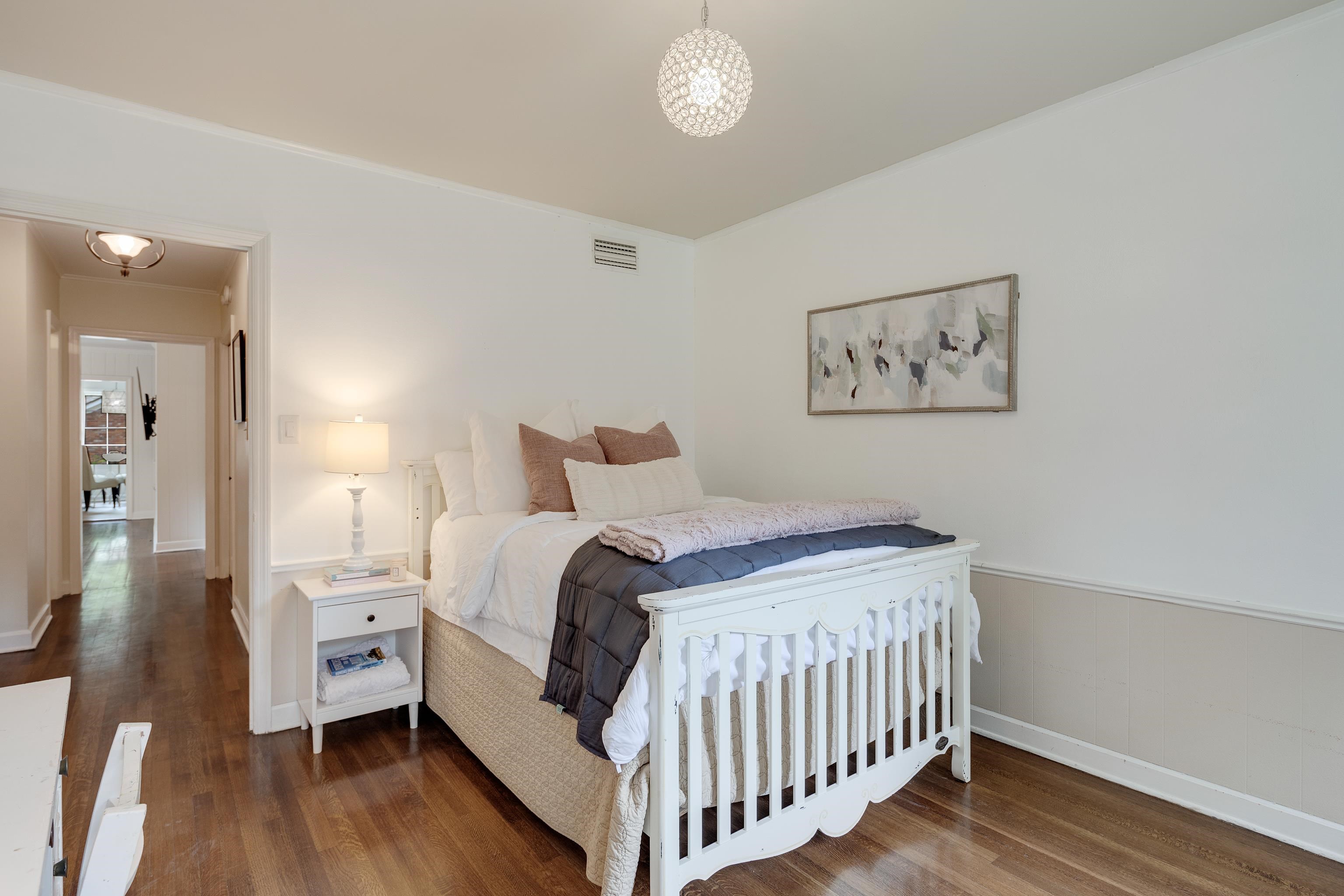 5371 South Angela Road Memphis, TN 38120 - Photo 16 of 25 a bedroom with a bed and a painting on the wall