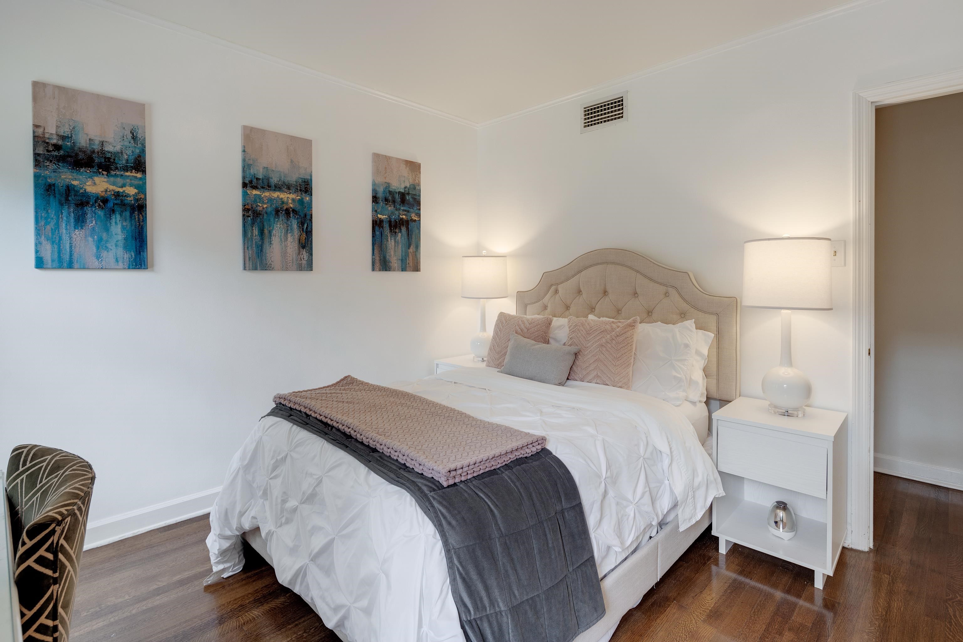5371 South Angela Road Memphis, TN 38120 - Photo 19 of 25 a bedroom with a bed and wooden floor