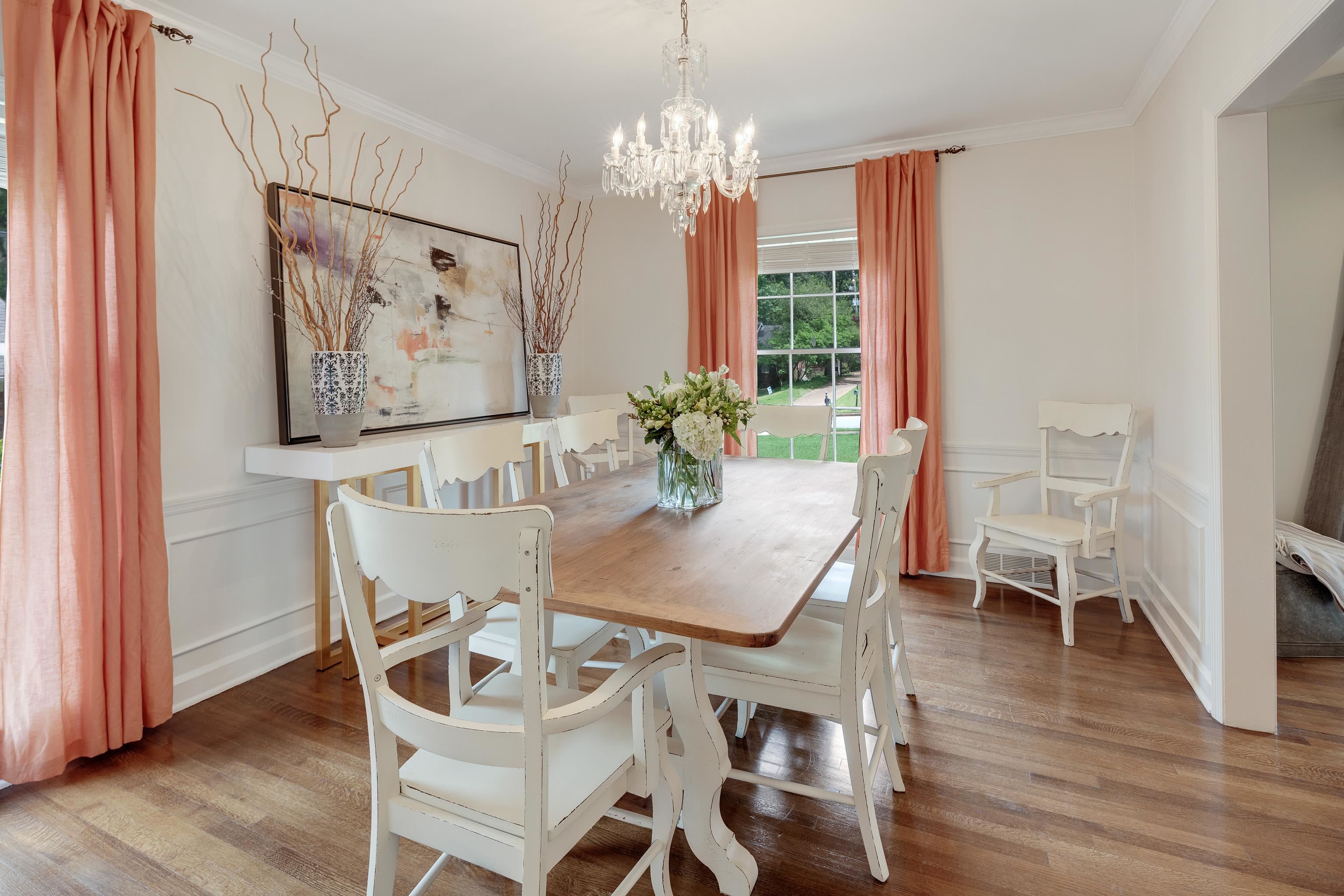 5371 South Angela Road Memphis, TN 38120 - Photo 8 of 25 a dining room with furniture a large window and wooden floor