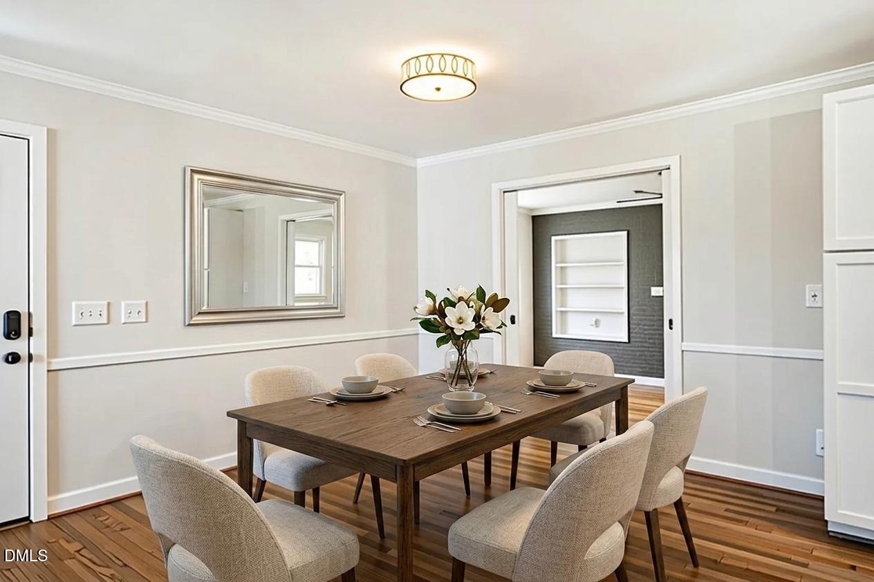 231 Flemington Road Chapel Hill, NC 27517 - Photo 12 of 48 a view of a dining room with furniture and wooden floor