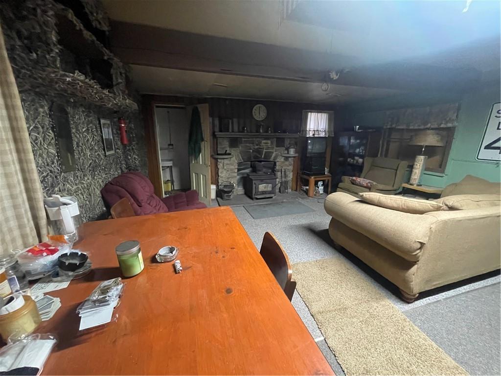 125 Spruce Road Confluence, PA 15424 - Photo 9 of 19 a living room with furniture and a fireplace