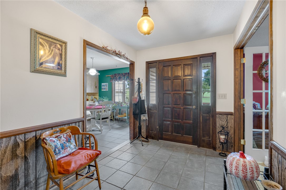 131 Bowen Road Anderson, SC 29621 - Photo 6 of 36 Rich wood trim frames the entry doors and open doorways leading to adjacent rooms.