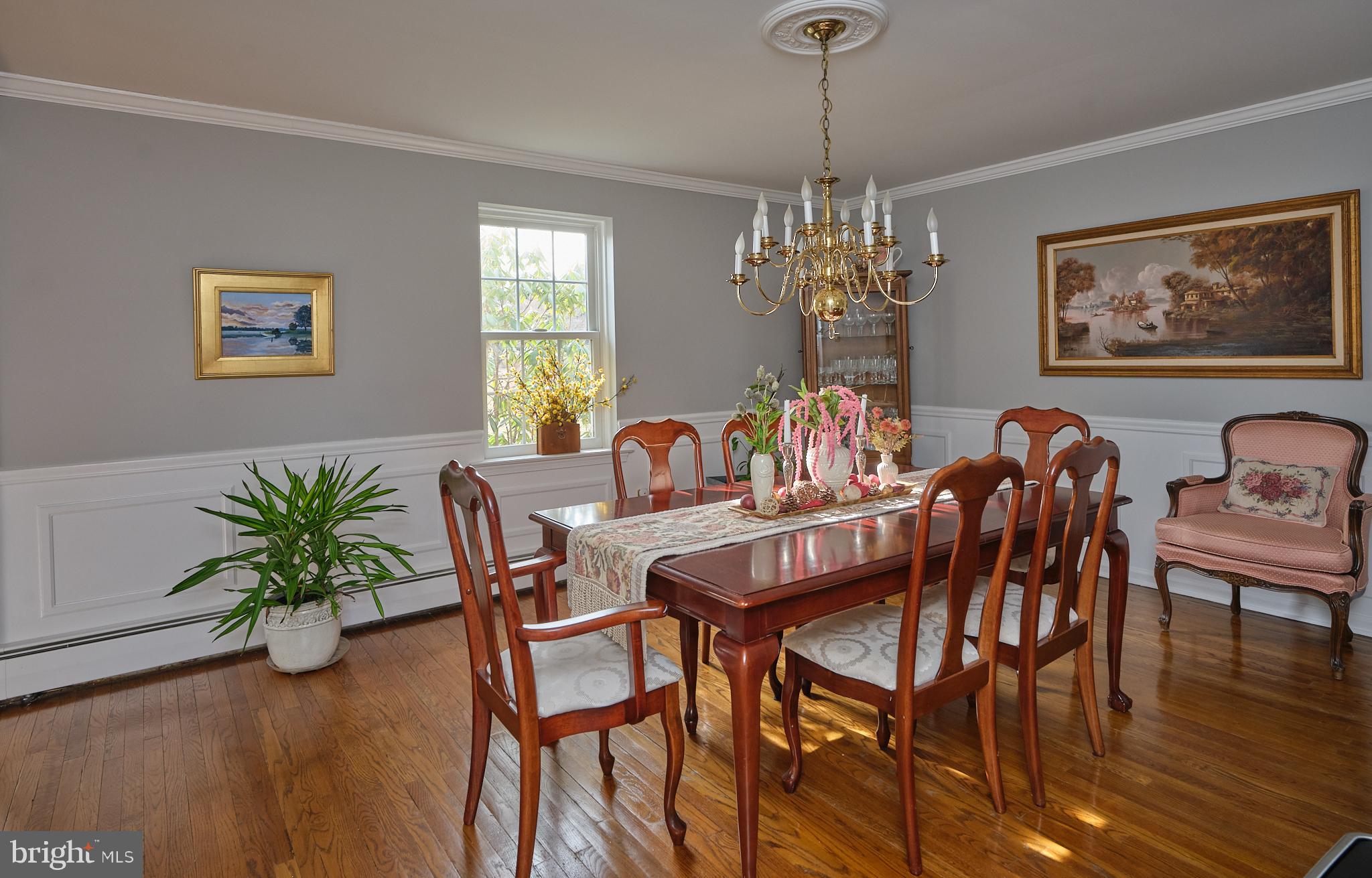 3889 Robin Road Furlong, PA 18925 - Photo 11 of 48 a dining room with furniture a chandelier and wooden floor