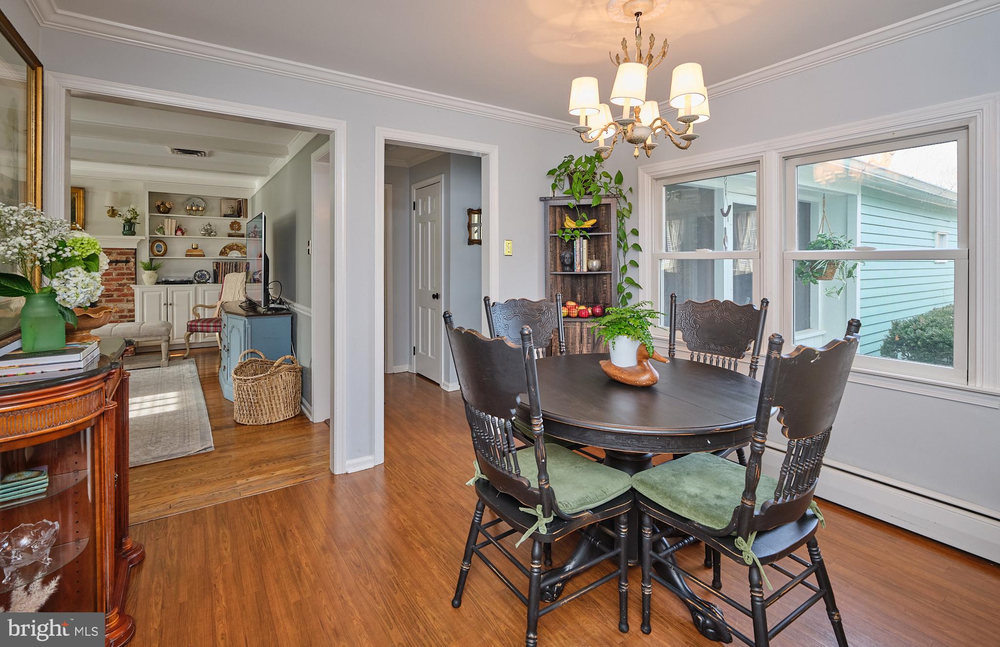 3889 Robin Road Furlong, PA 18925 - Photo 16 of 48 a view of a dining room with furniture wooden floor and chandelier