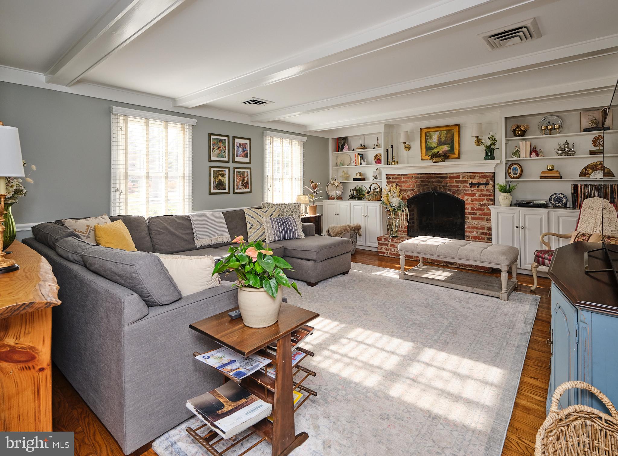 3889 Robin Road Furlong, PA 18925 - Photo 17 of 48 a living room with furniture large window and a fireplace