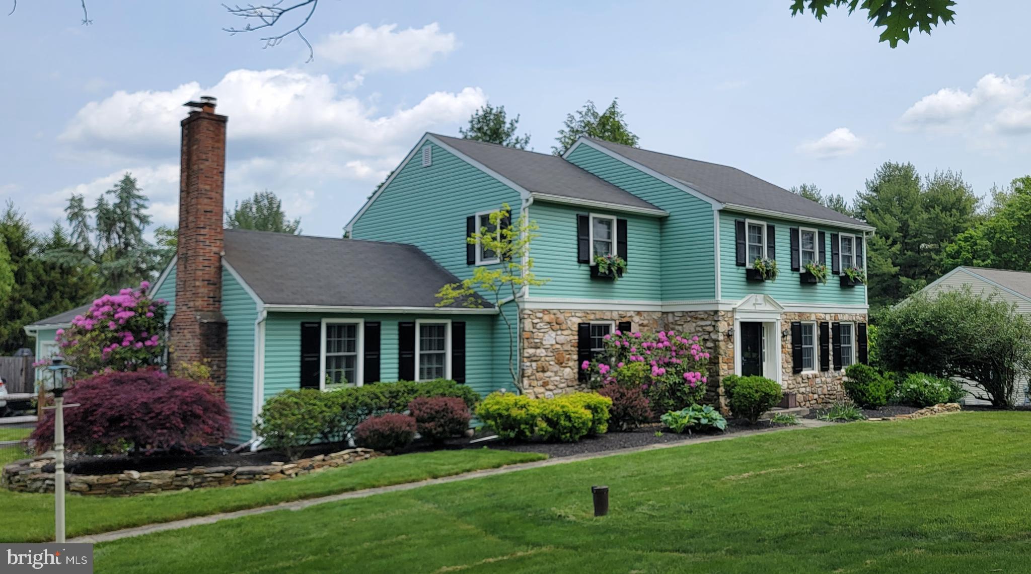 3889 Robin Road Furlong, PA 18925 - Photo 2 of 48 a front view of a house with garden