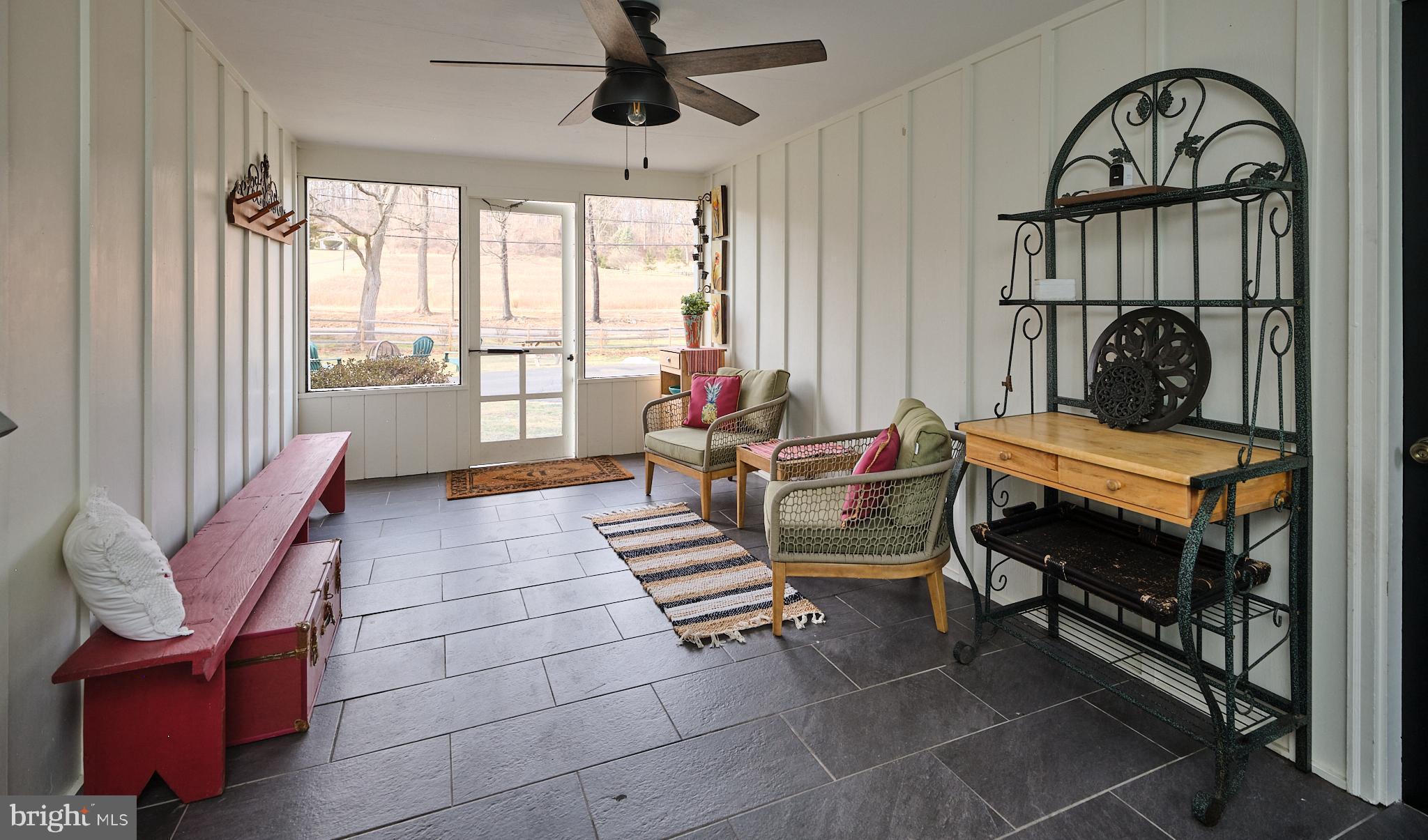 3889 Robin Road Furlong, PA 18925 - Photo 22 of 48 a living room with furniture and a fireplace