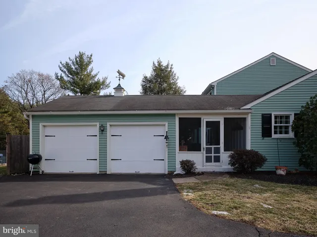 a bedroom with a bed and a dresser in it