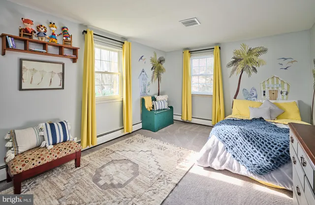 a living room with furniture and a rug