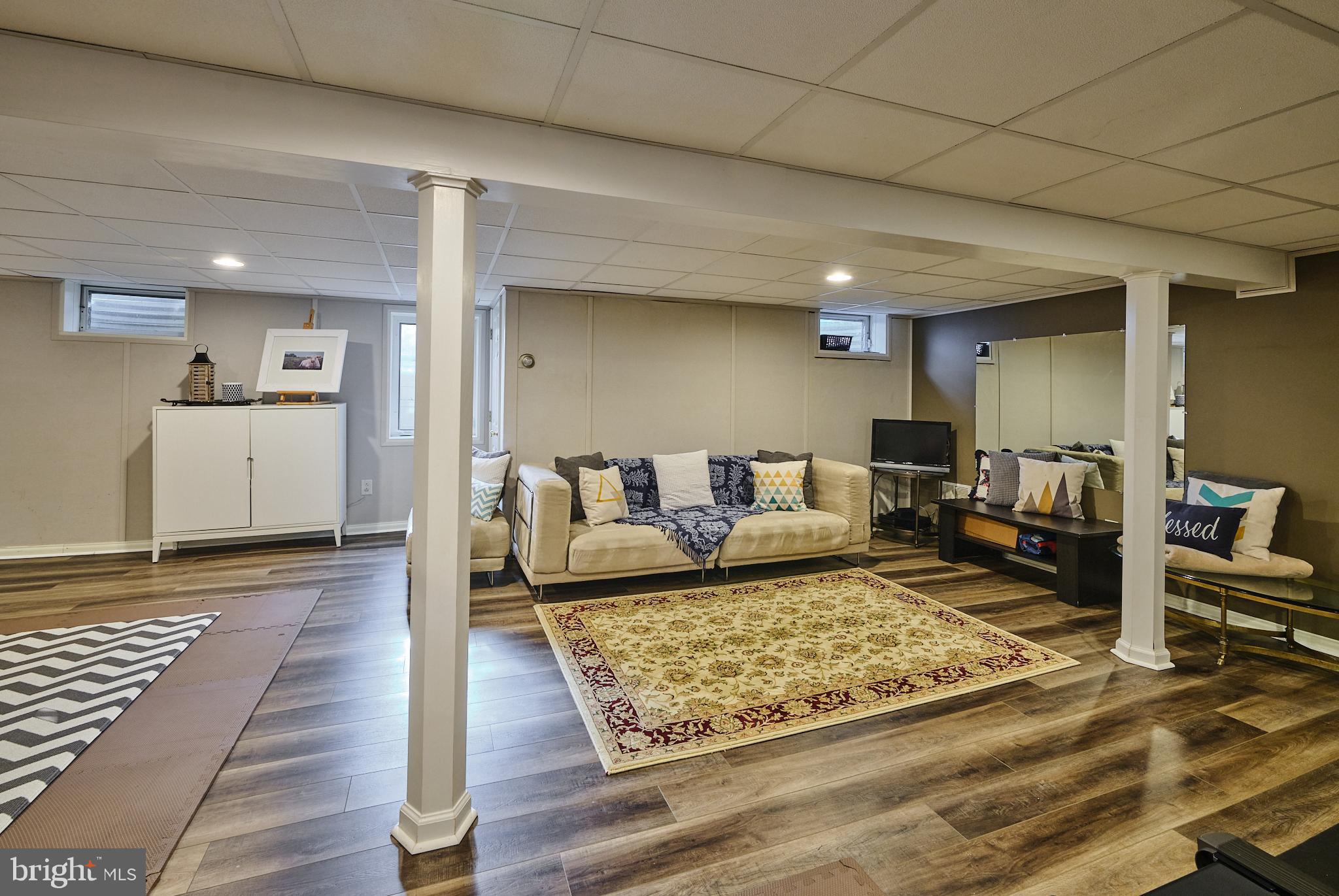 3889 Robin Road Furlong, PA 18925 - Photo 34 of 48 a living room with furniture and a rug