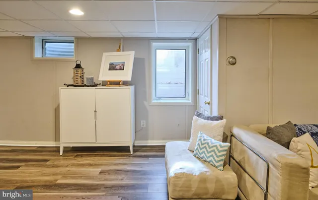 a view of backyard with table and chairs under an umbrella