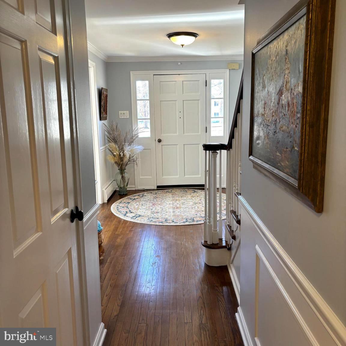 3889 Robin Road Furlong, PA 18925 - Photo 8 of 48 a view of a hallway with wooden floor and staircase