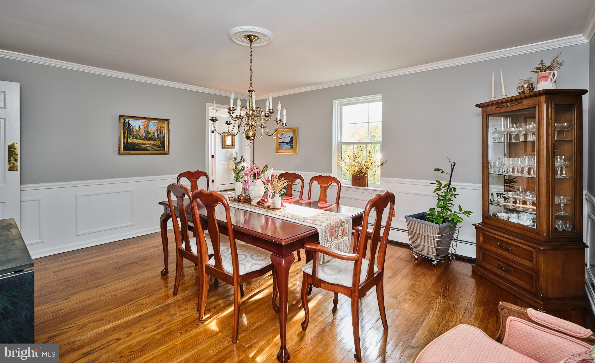 3889 Robin Road Furlong, PA 18925 - Photo 10 of 48 a view of a dining room with furniture wooden floor and chandelier