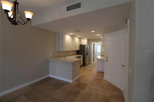 a view of a hallway with seating area
