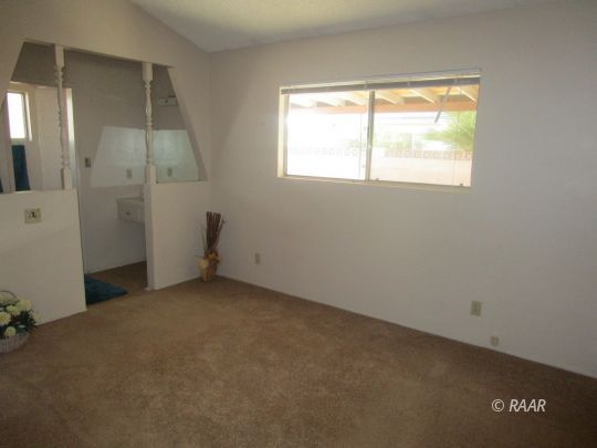 232 South Silver Ridge Street Ridgecrest, CA 93555 - Photo 14 of 19 an empty room with windows