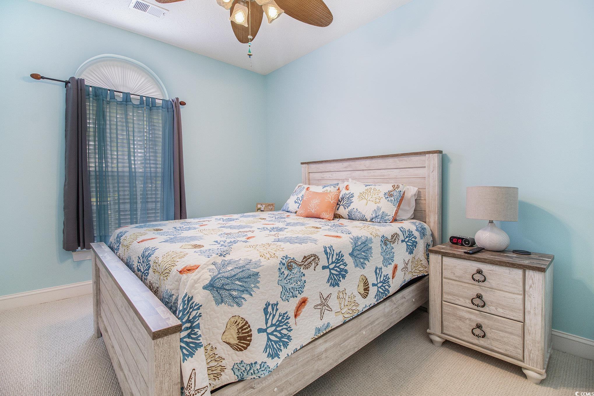 1141 Peace Pipe Place, Unit 101 Myrtle Beach, SC 29579 - Photo 14 of 28 Carpeted bedroom featuring baseboards and ceiling fan