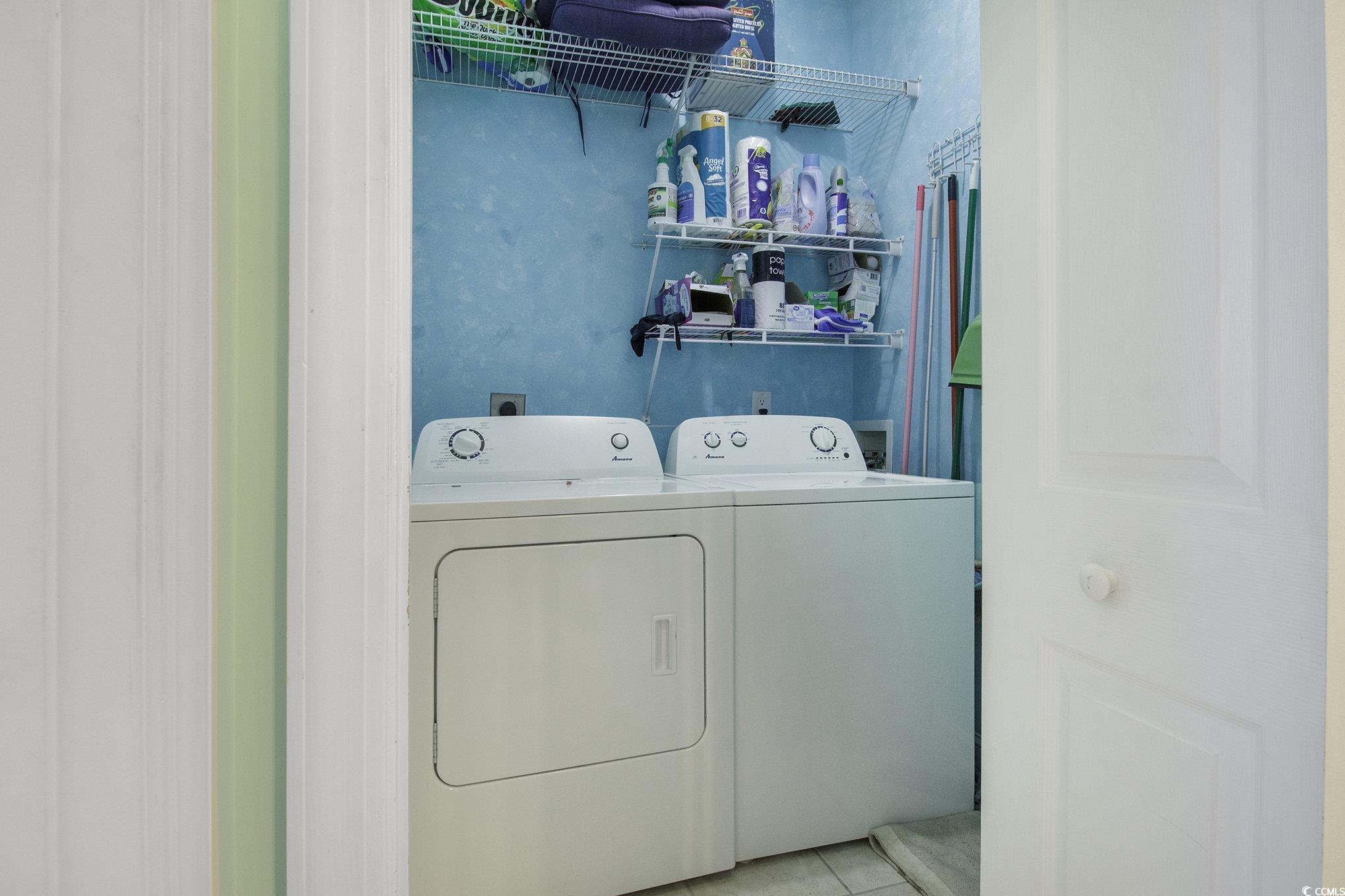1141 Peace Pipe Place, Unit 101 Myrtle Beach, SC 29579 - Photo 23 of 28 Laundry room featuring washing machine and clothes dryer and light tile patterned floors