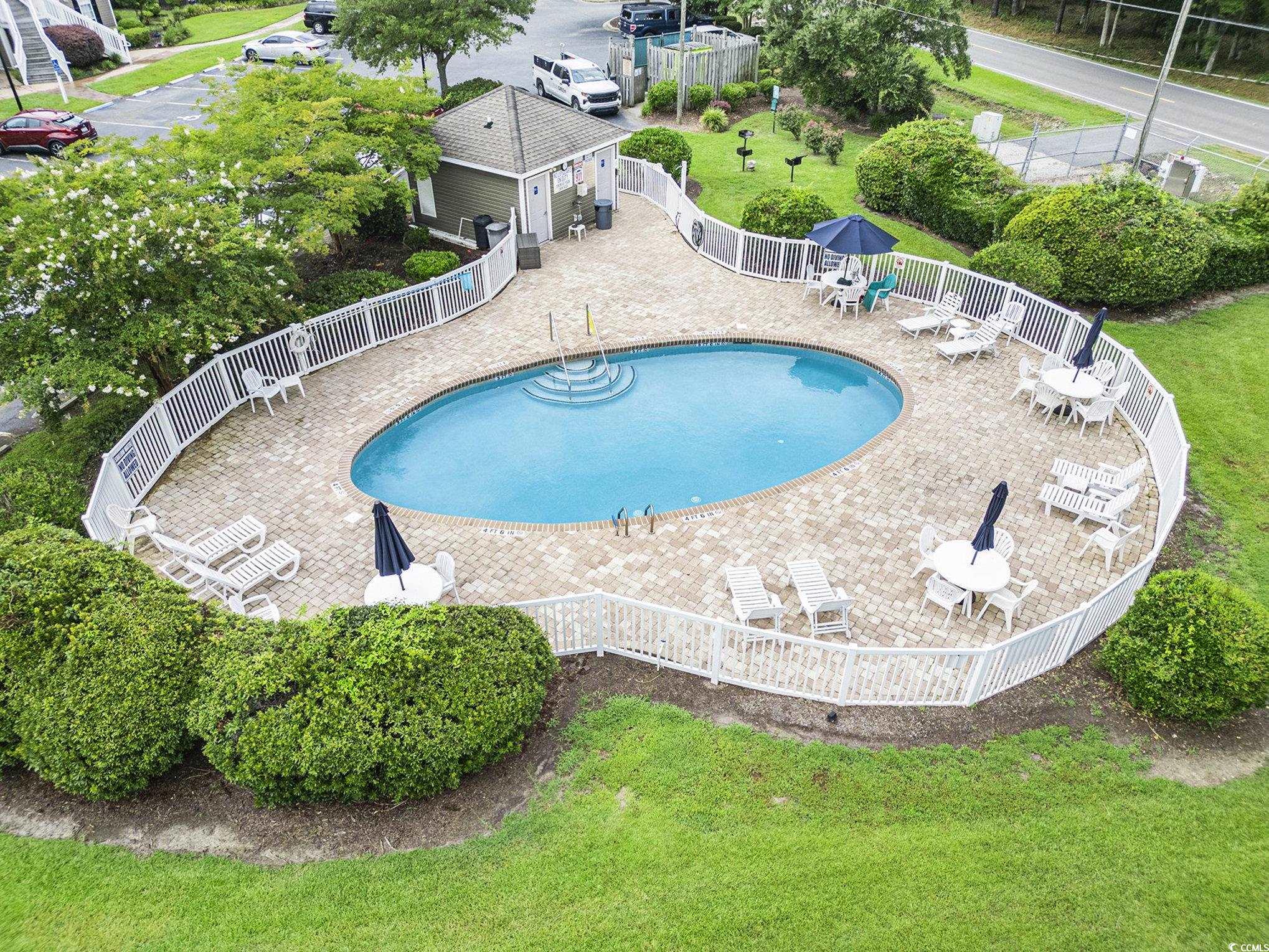 1141 Peace Pipe Place, Unit 101 Myrtle Beach, SC 29579 - Photo 28 of 28 Community pool with a patio area