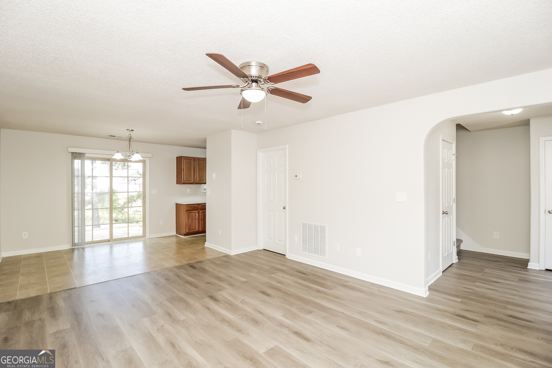 82 Gilliam Crossing Cartersville, GA 30120 - Photo 5 of 17 a view of an empty room with window and wooden floor