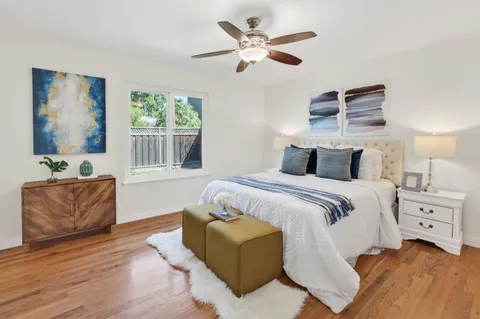 a bedroom with a large bed and a couch