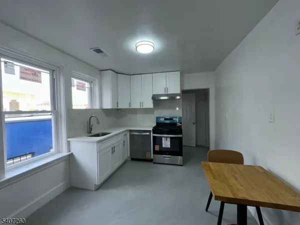 a room with a chair and a window