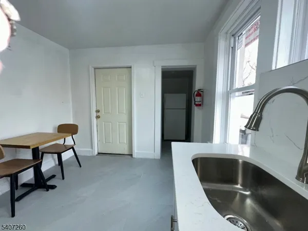 a view of an empty room with closet