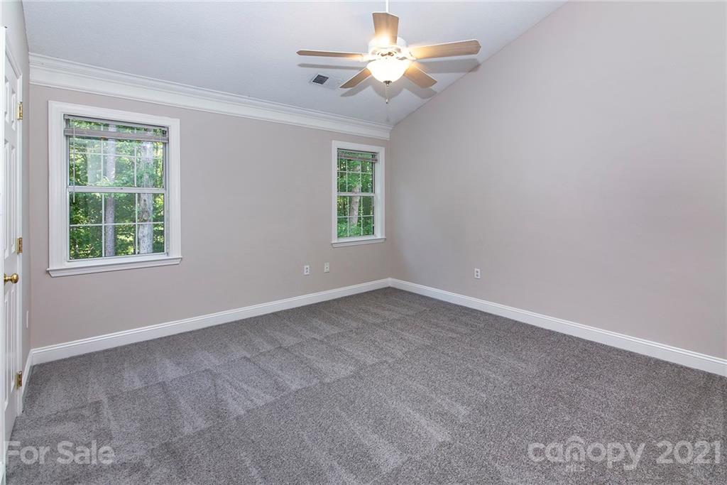 3518 Rindle Court Charlotte, NC 28269 - Photo 11 of 21 an empty room with a window and a fan