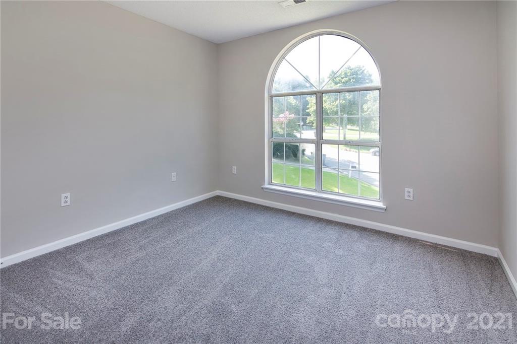3518 Rindle Court Charlotte, NC 28269 - Photo 13 of 21 an empty room with a window
