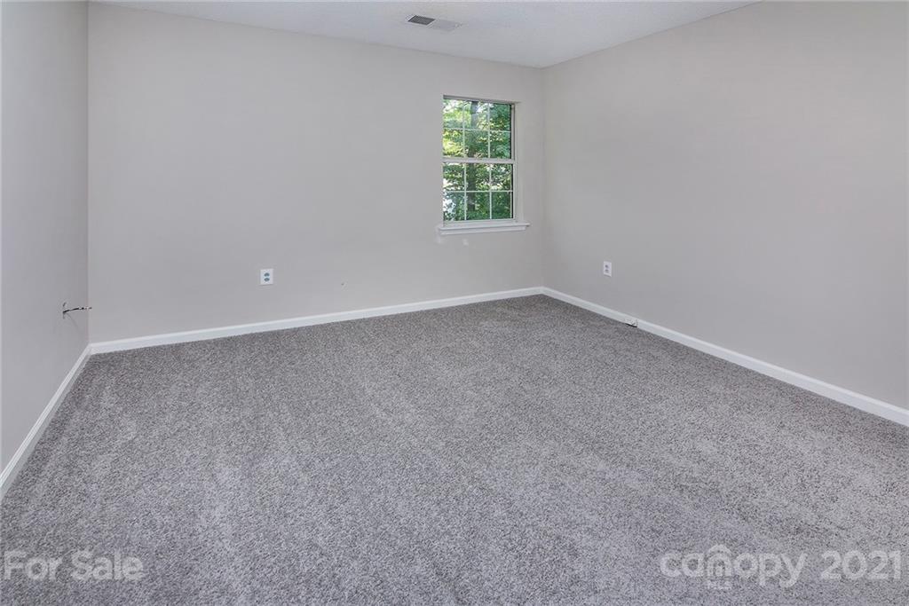 3518 Rindle Court Charlotte, NC 28269 - Photo 16 of 21 an empty room with a window