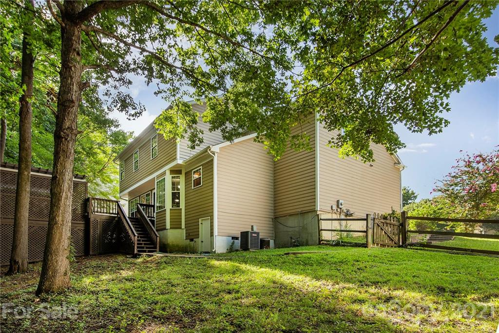 3518 Rindle Court Charlotte, NC 28269 - Photo 17 of 21 a view of a house with backyard