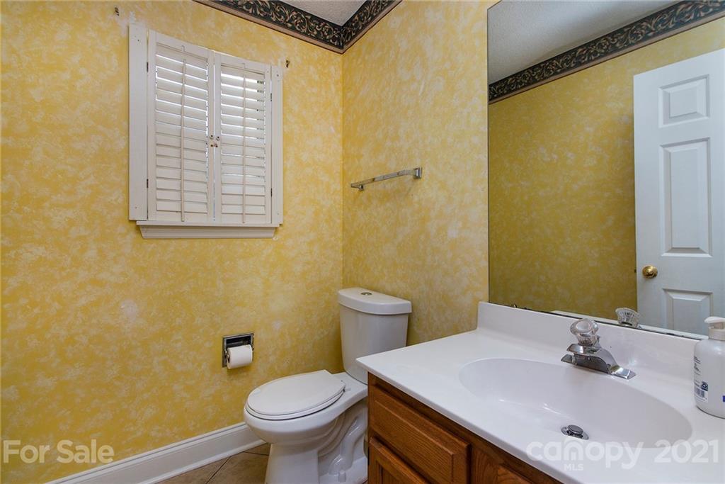 3518 Rindle Court Charlotte, NC 28269 - Photo 10 of 21 a bathroom with a sink and a toilet