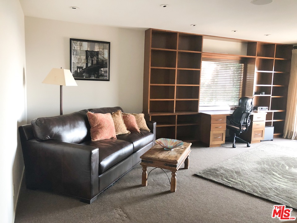410 Walker Drive Beverly Hills, CA 90210 - Photo 16 of 36 a living room with furniture
