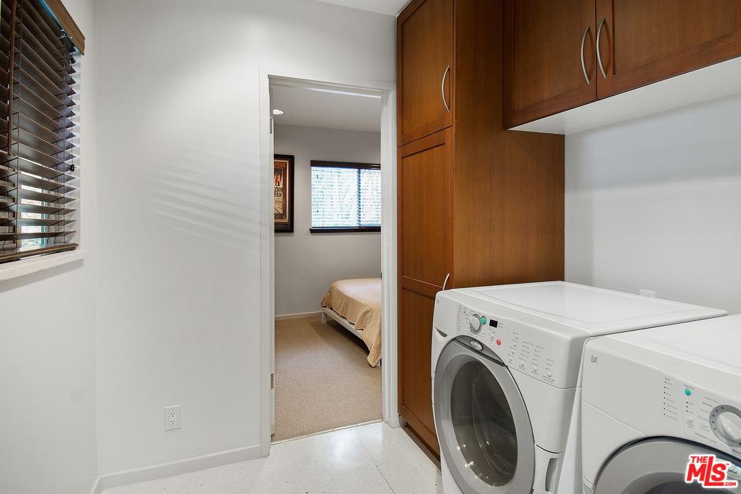 410 Walker Drive Beverly Hills, CA 90210 - Photo 17 of 36 a utility room with dryer and washer