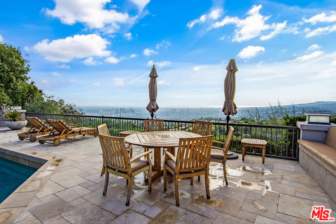 410 Walker Drive Beverly Hills, CA 90210 - Photo 32 of 36 a view of a terrace with furniture and stove