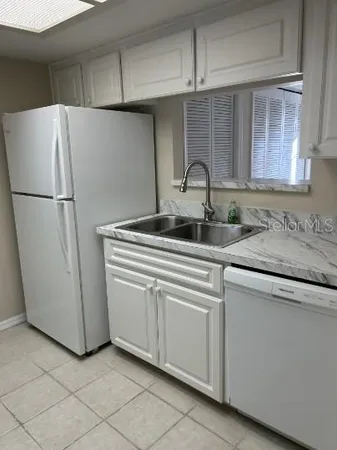 a kitchen with appliances and cabinets