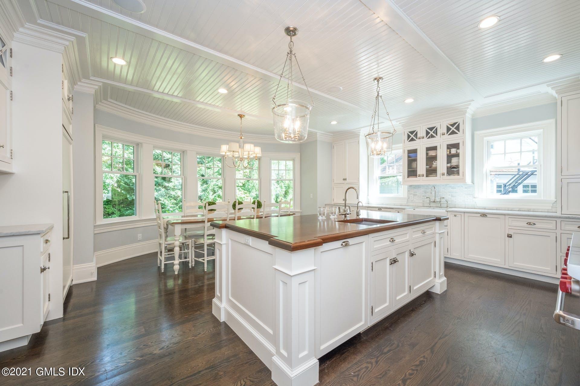 45 Willow Road Riverside, CT 06878 - Photo 12 of 38 a kitchen with granite countertop a stove and a wooden floors